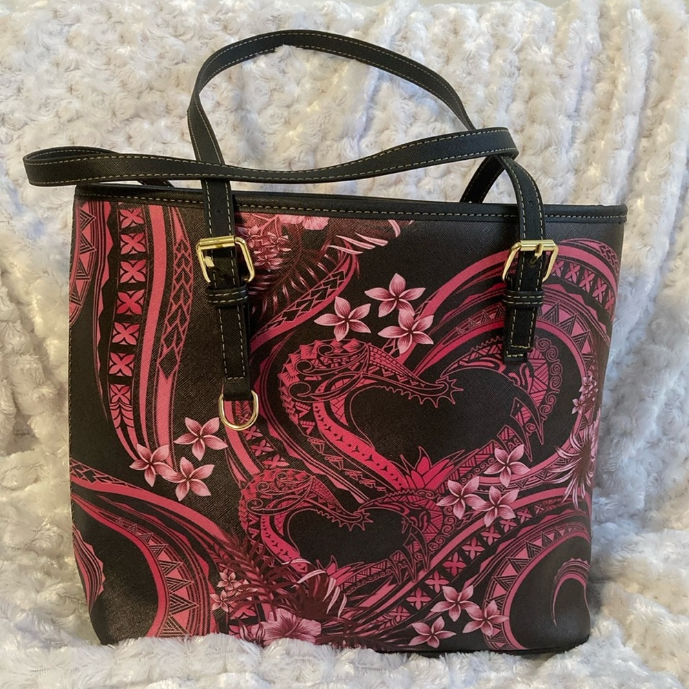 Tribal print bag with hearts and flowers. Gold hardware. Adjustable straps.